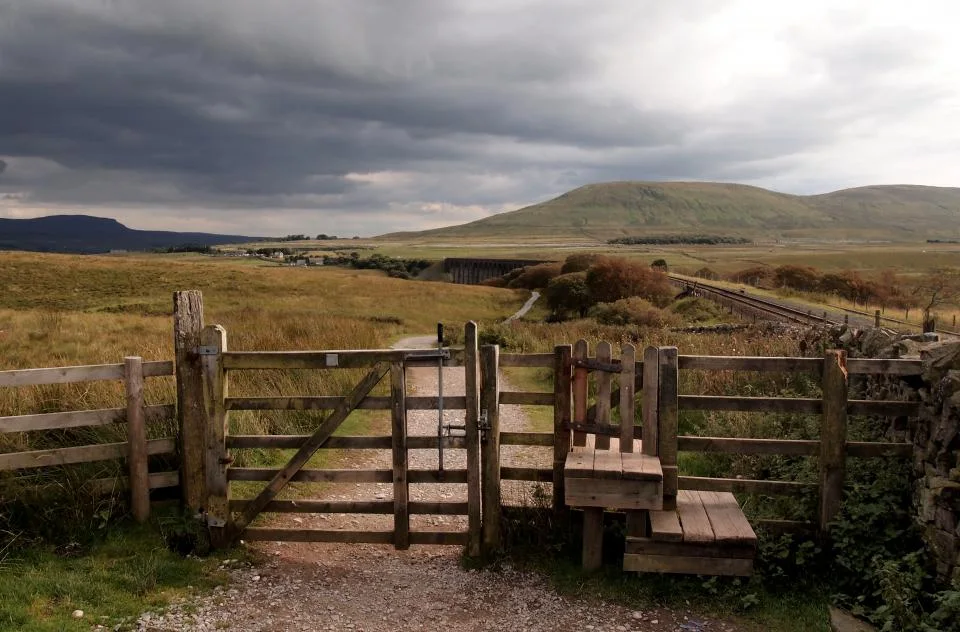 Timber gate and rails on a hill